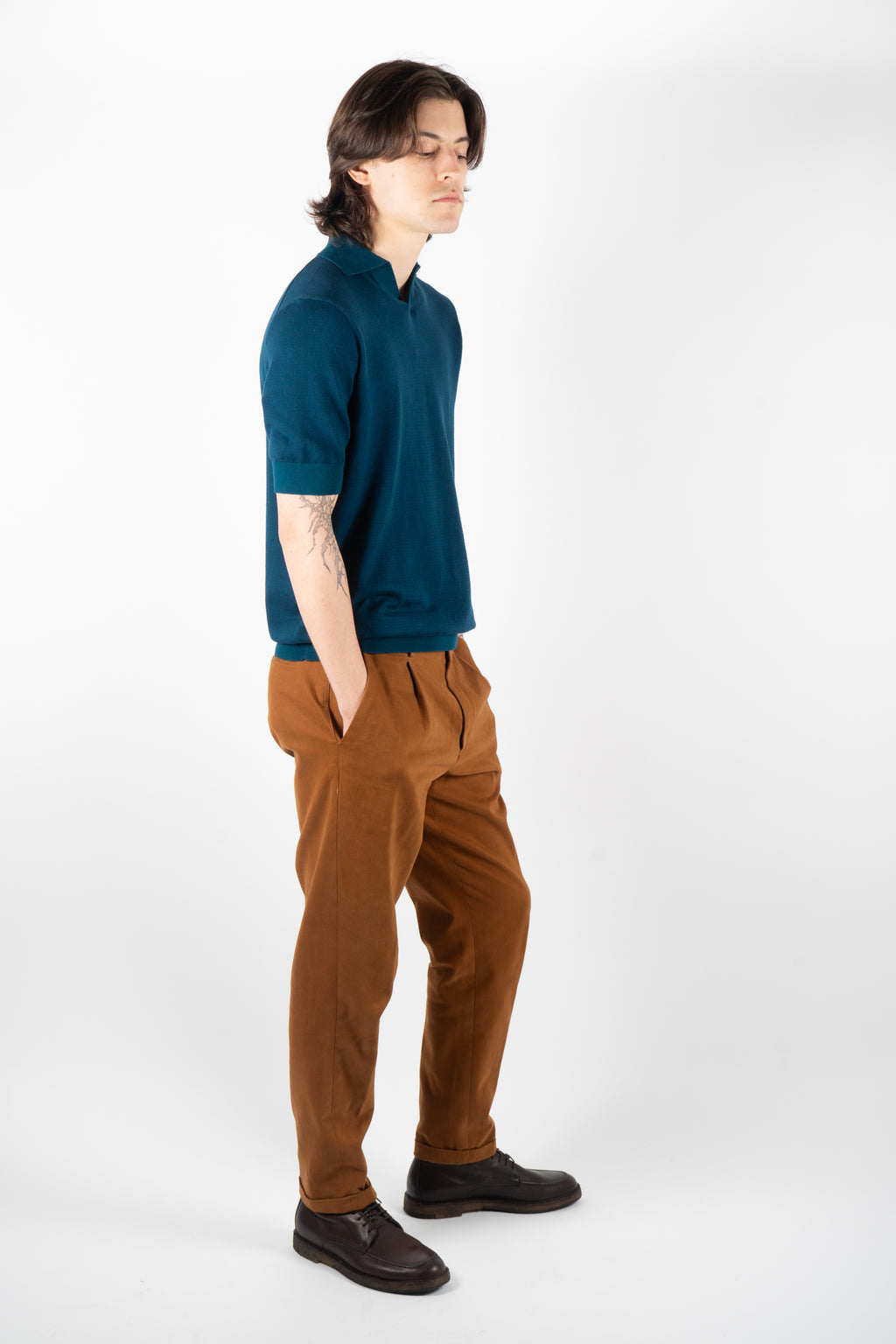 teal knit polo textured fabric